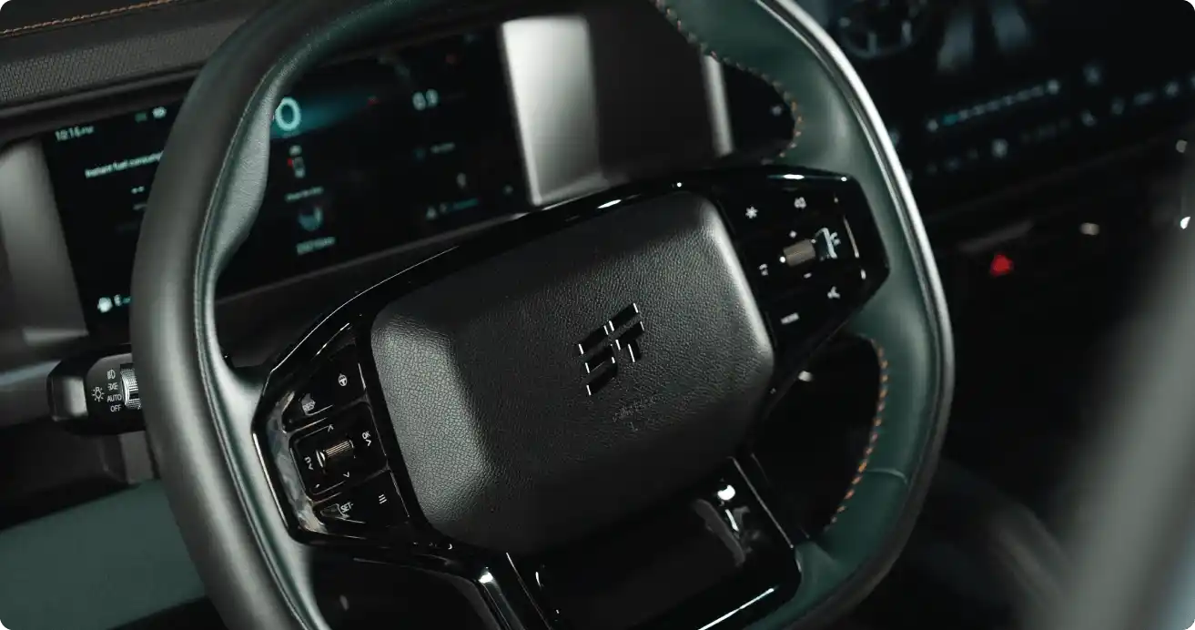 Off-road rental JETOUR tackling muddy track with splashing tires