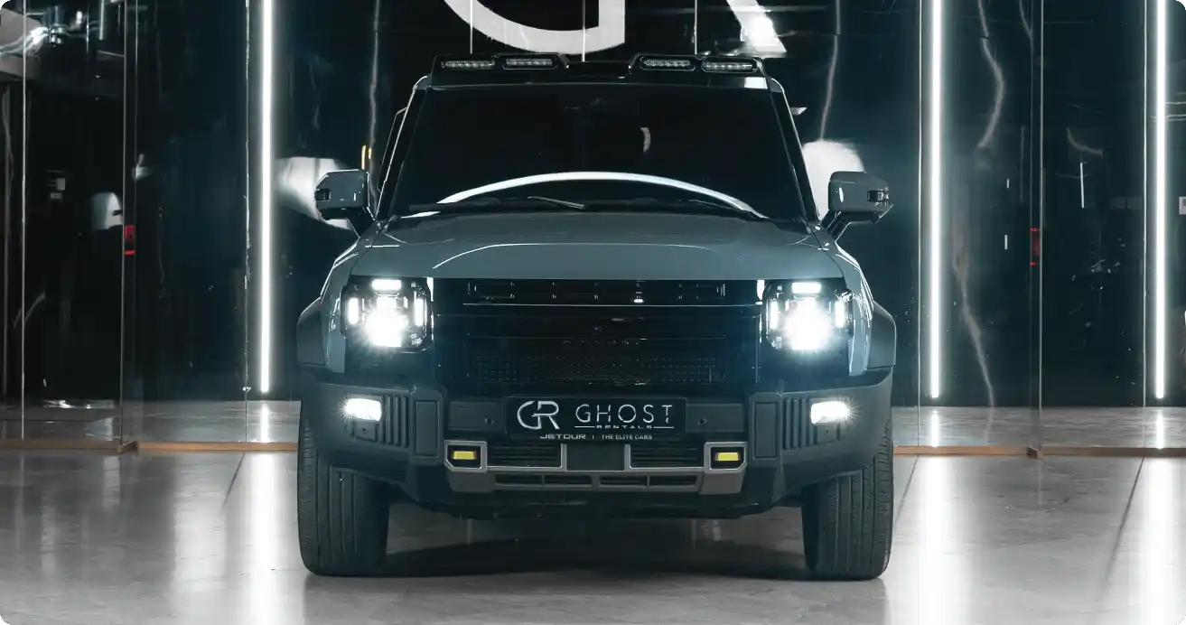 Grey-blue JETOUR T2 parked beside coastal lookout at sunrise