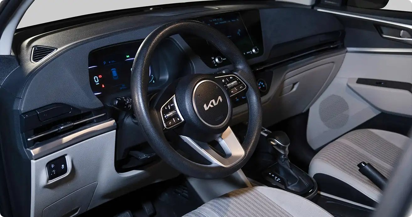 Kia Carens available for Dubai car rental with spacious interior and luggage room